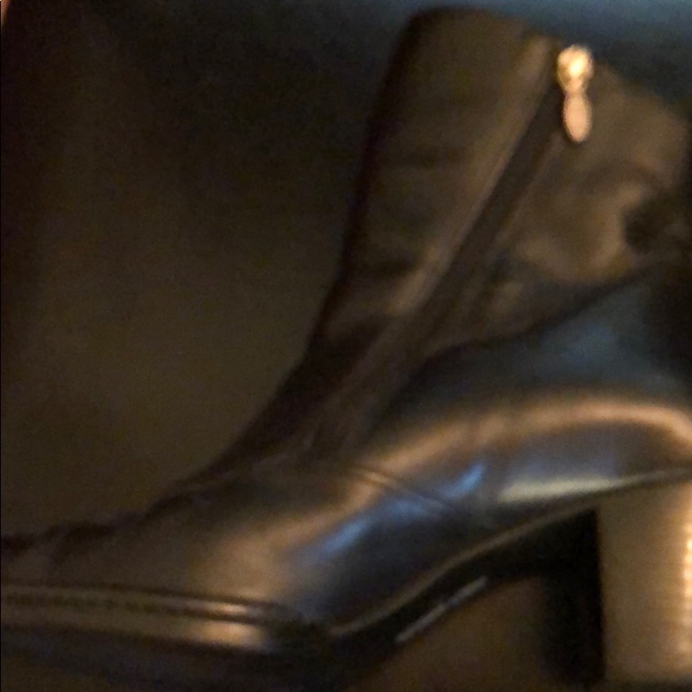 Women’s black leather boots.